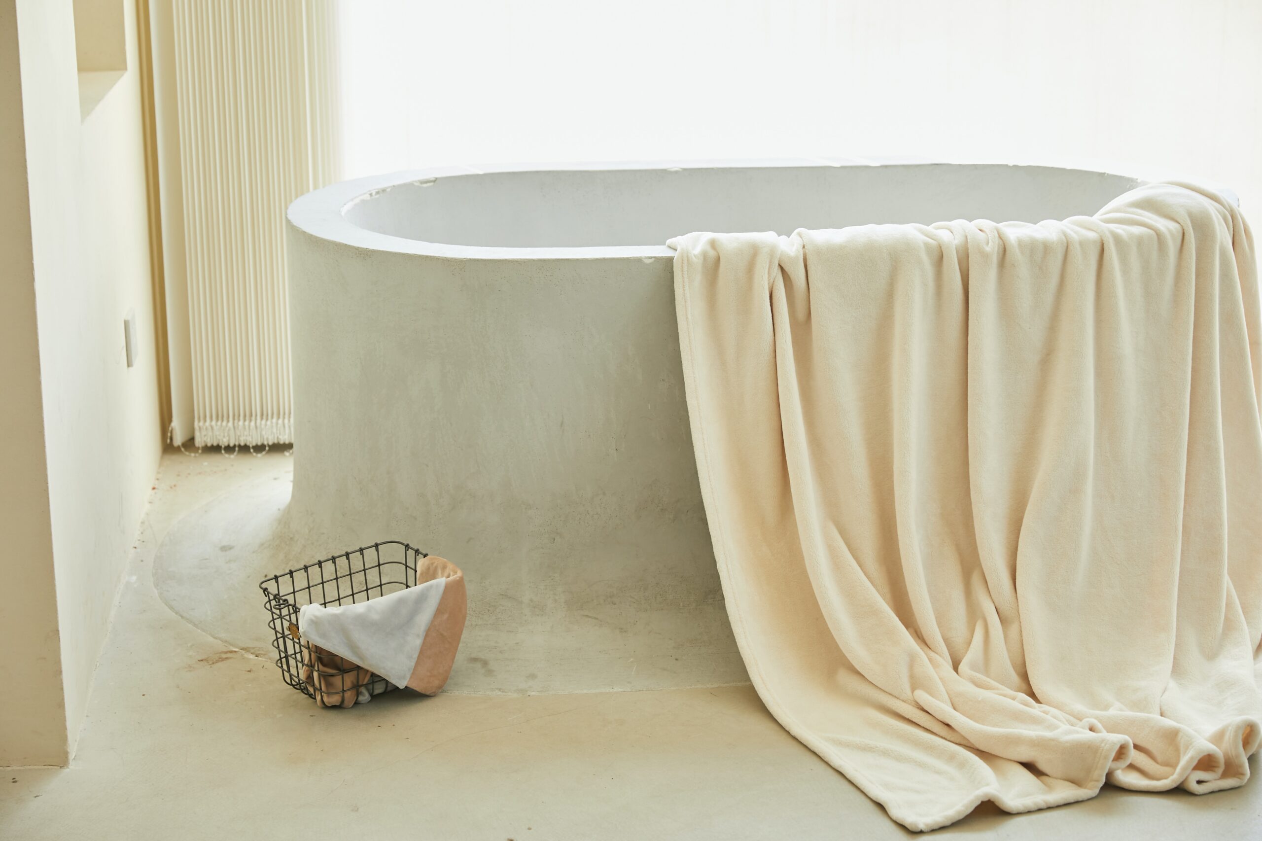 bathtub with cream colored towel
