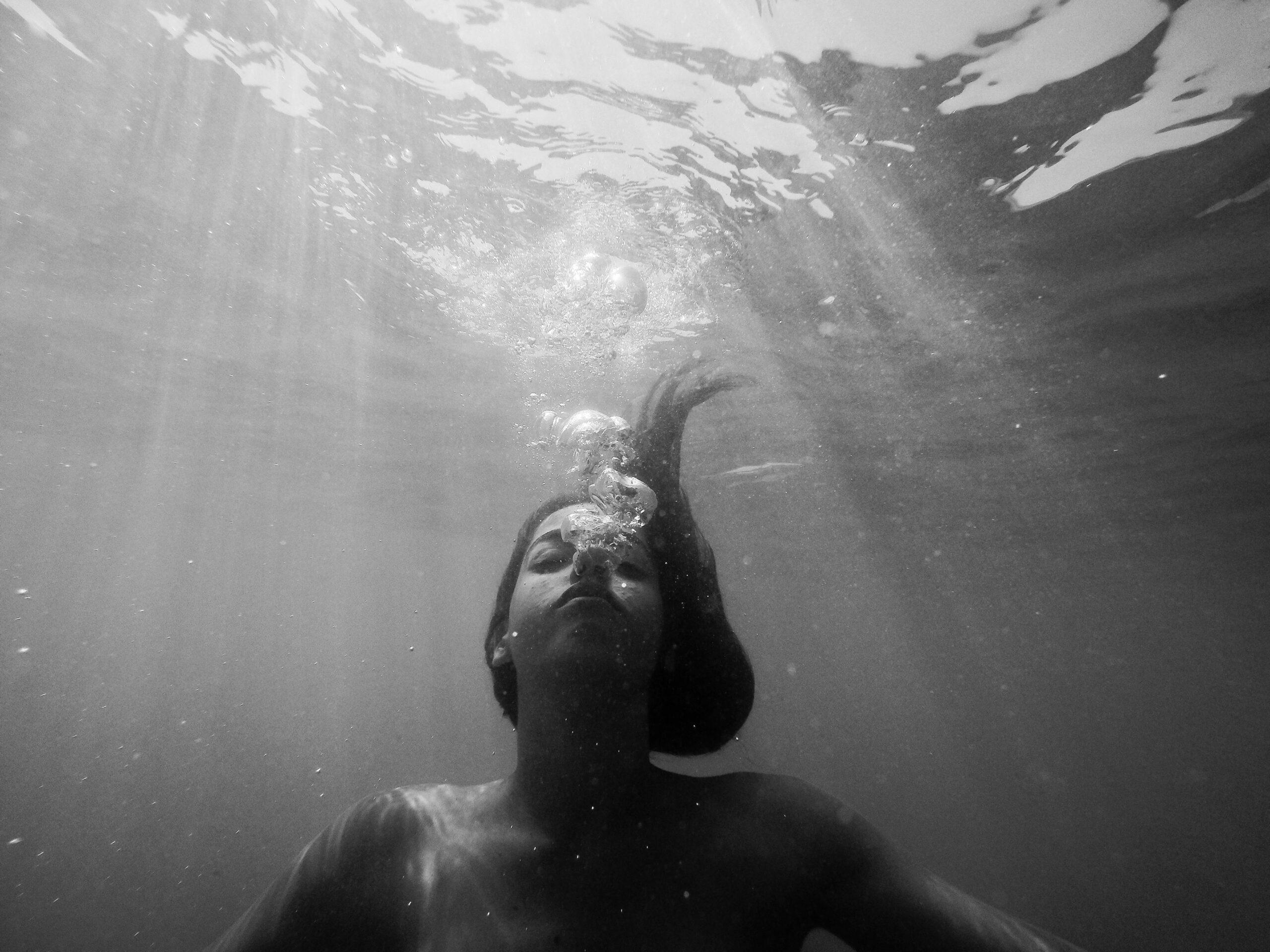 woman with long hair underwater