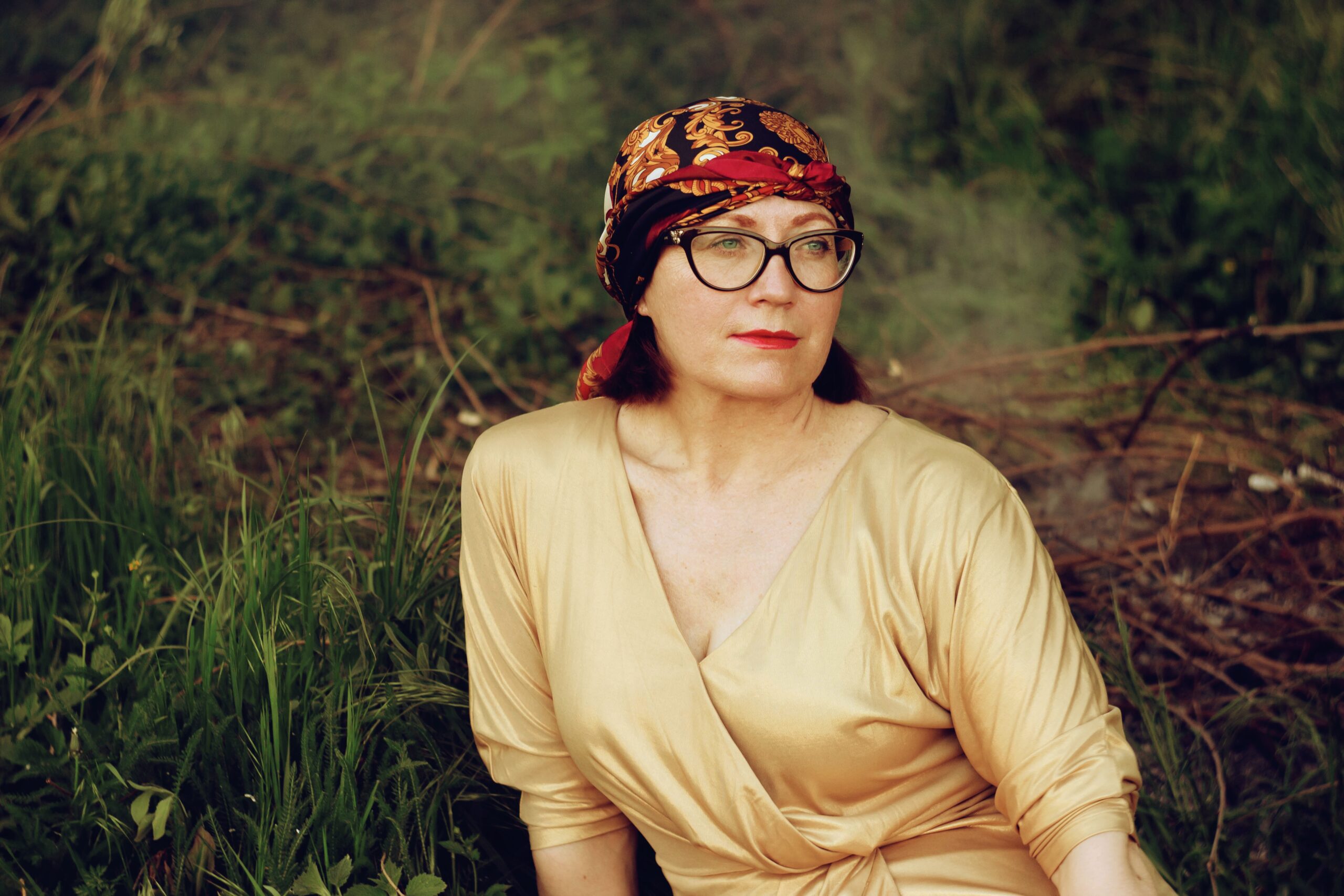 woman in head covering in the forest