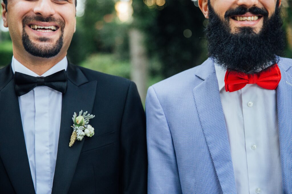two men in suits with bow ties