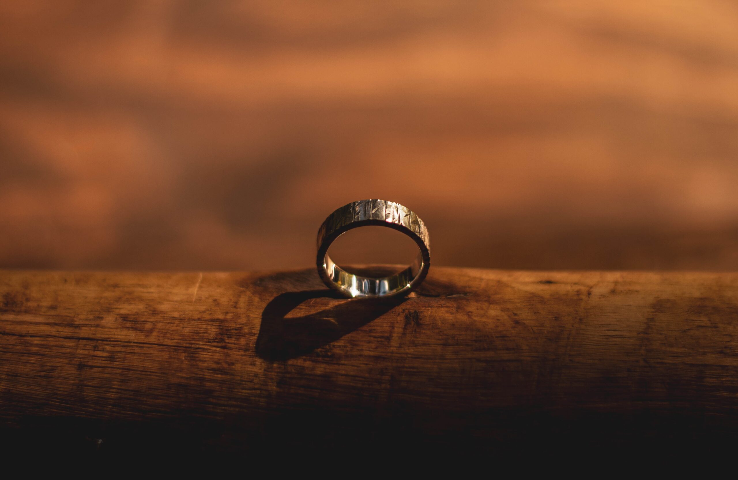 wedding band on a piece of wood