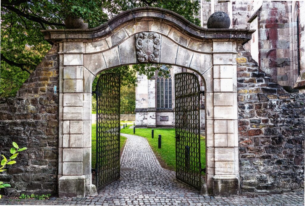 a stone entrance with open gates