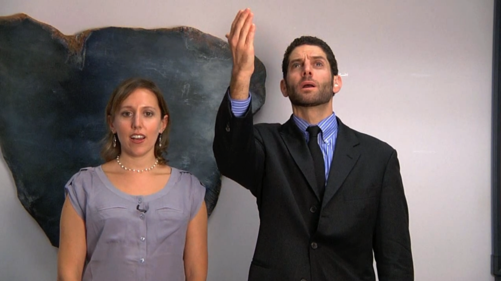 woman sings and man signs torah blessings