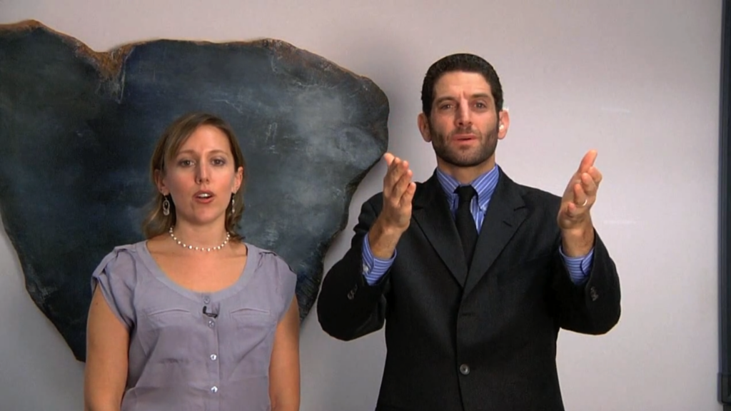 woman sings and man signs torah blessings