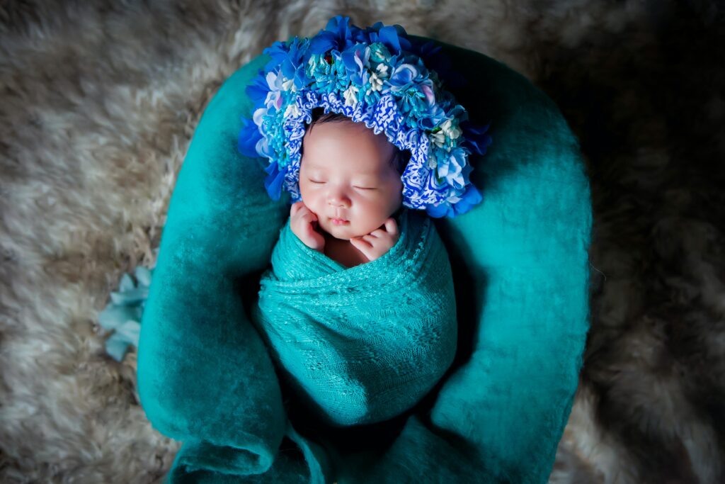 newborn girl with headdress