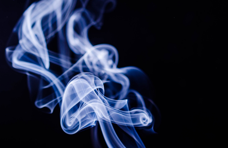 smoke swirling against a dark background