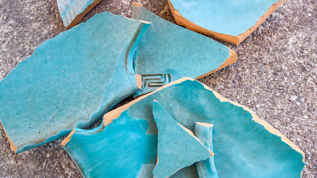 pieces of broken teal ceramic