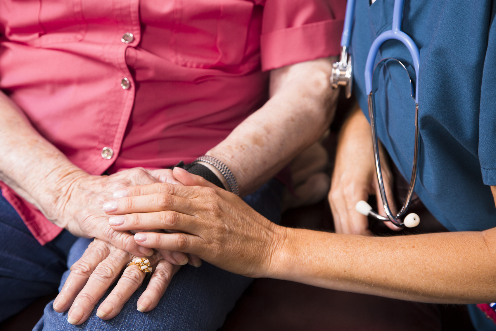 a nurse holding someone's hand