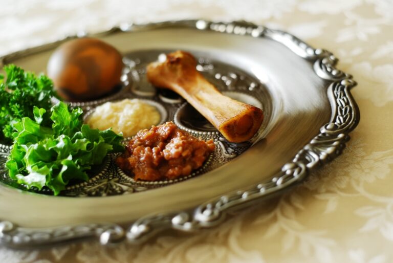 items on a silver seder plate