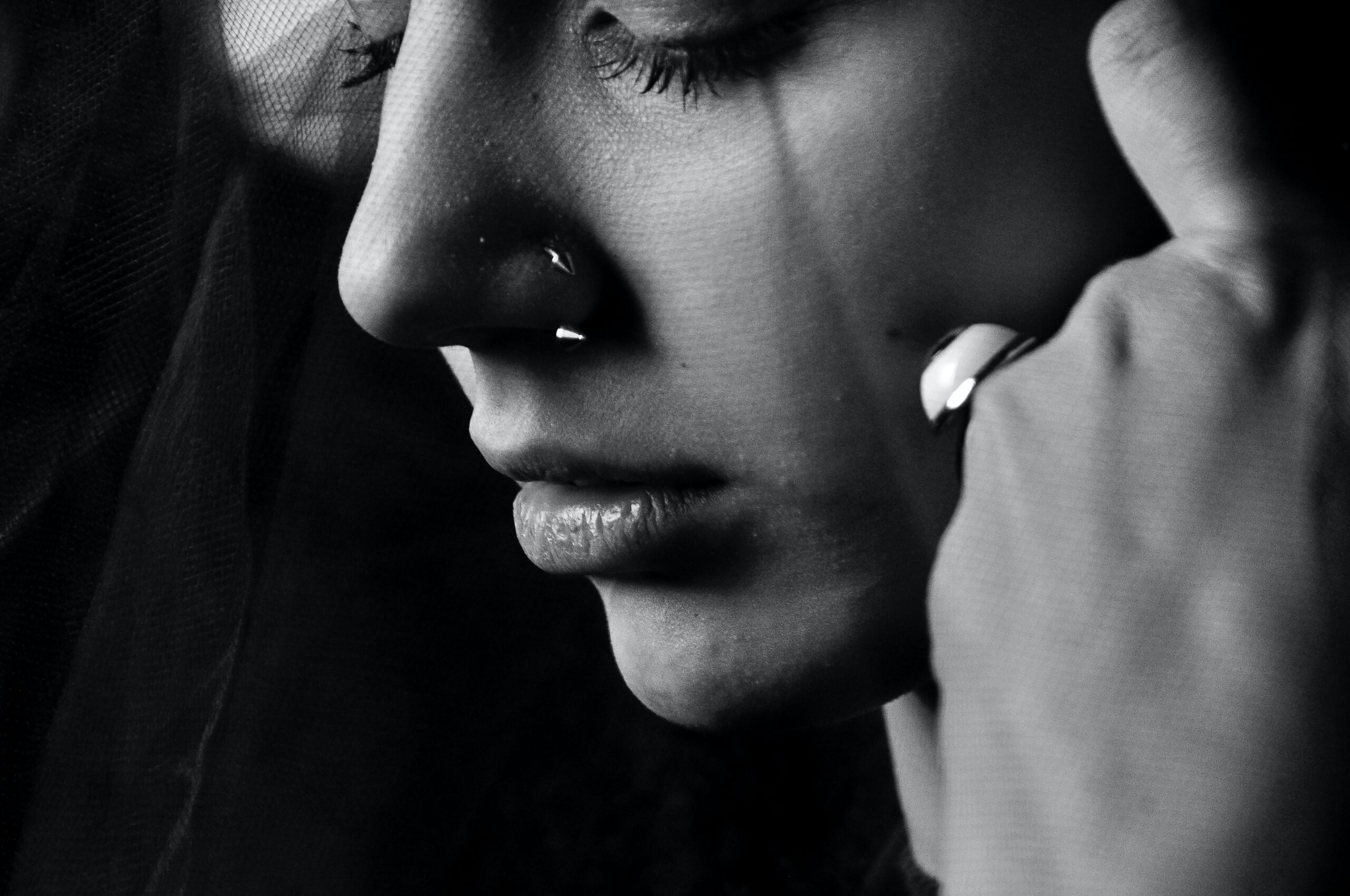 a tear streamed face of a young woman
