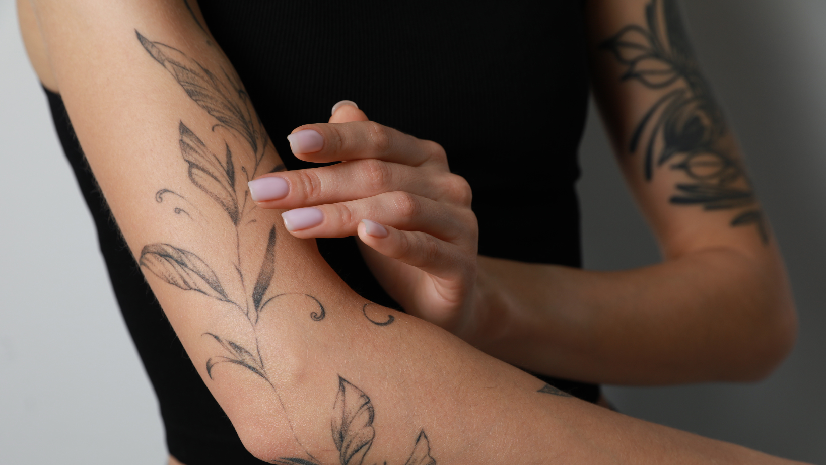 an arm covered with a tattoo