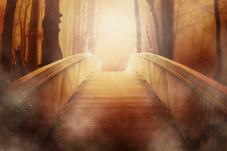 a bridge with sunlight at its end