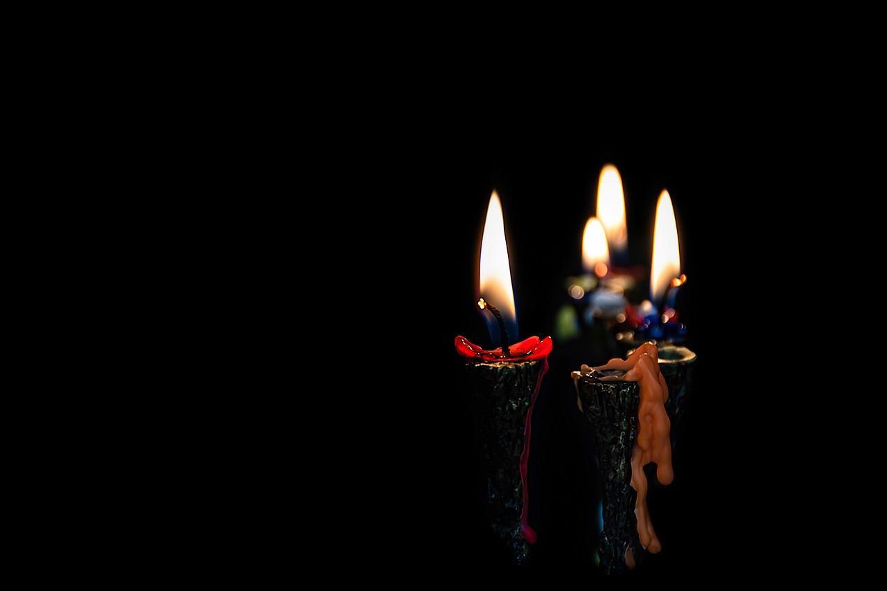 candle flames melt down in a hanukkah menorah