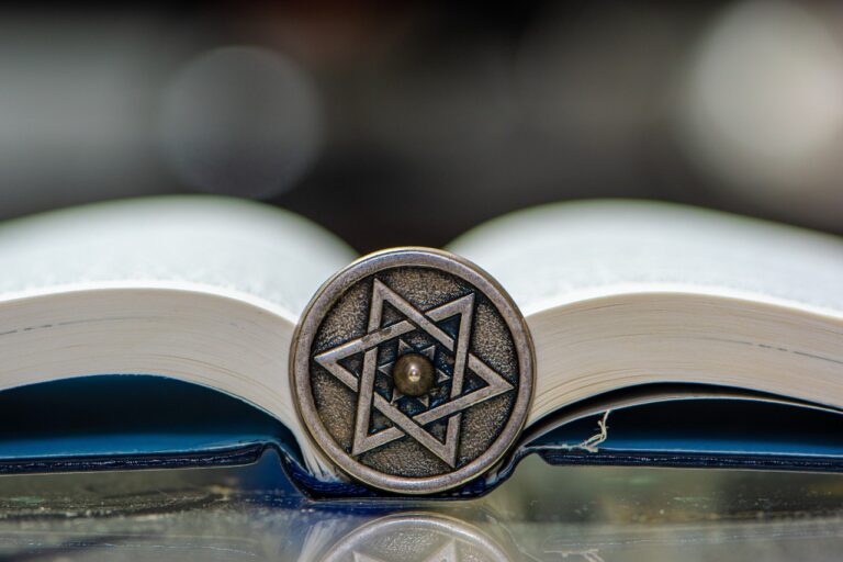 an open prayer book with a Jewish star