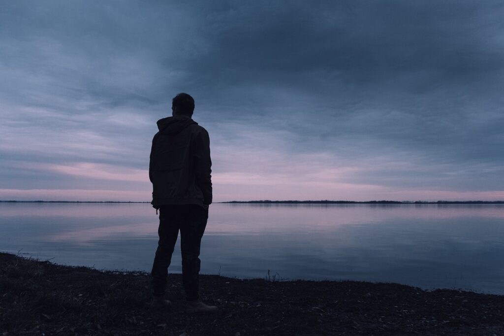 A man walks alone at the sea