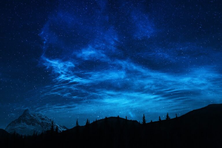 the night sky over mountains