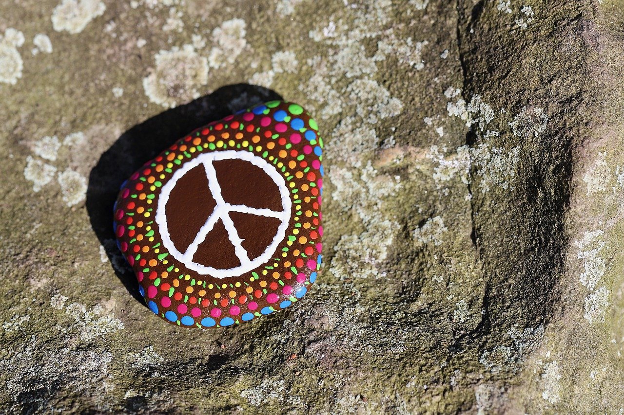 a peace sign painted on a stone