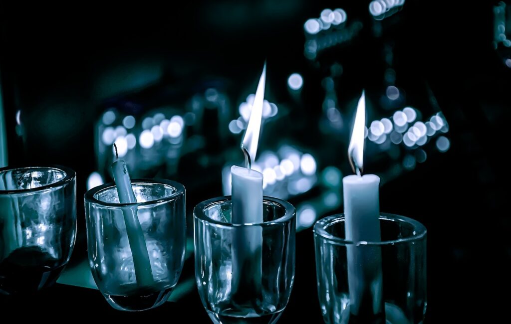 candles set in glass votives