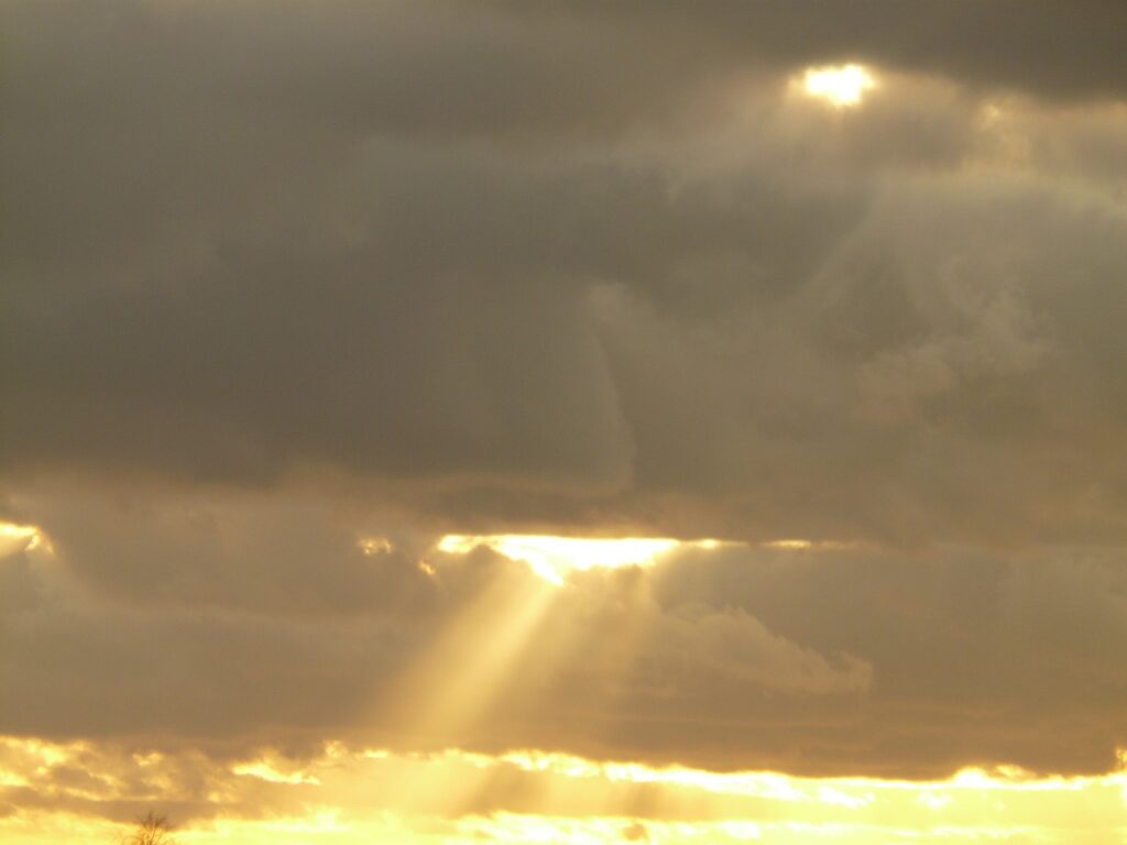 sun streaming through clouds