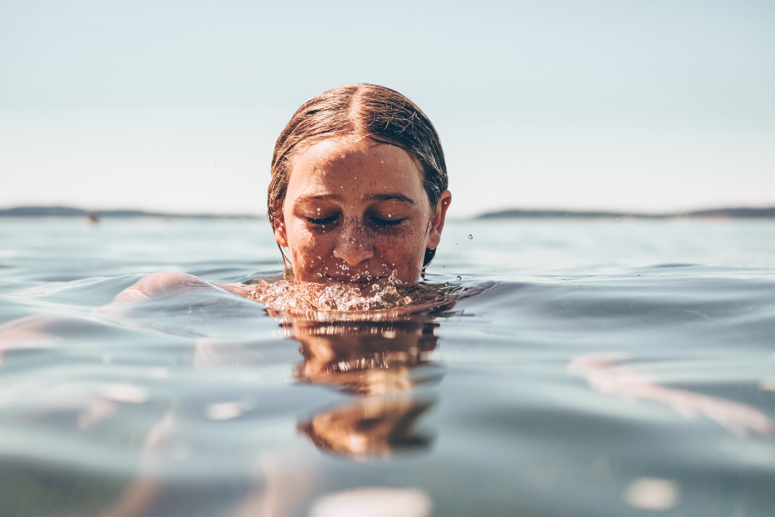 a woman immersiong in water