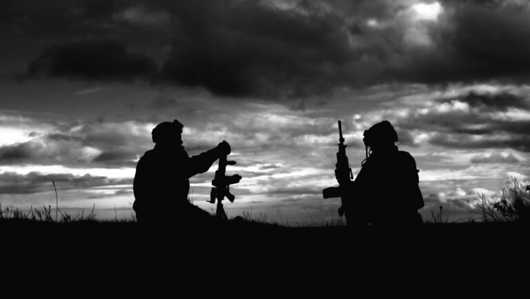 a black and white photo of two soldiers