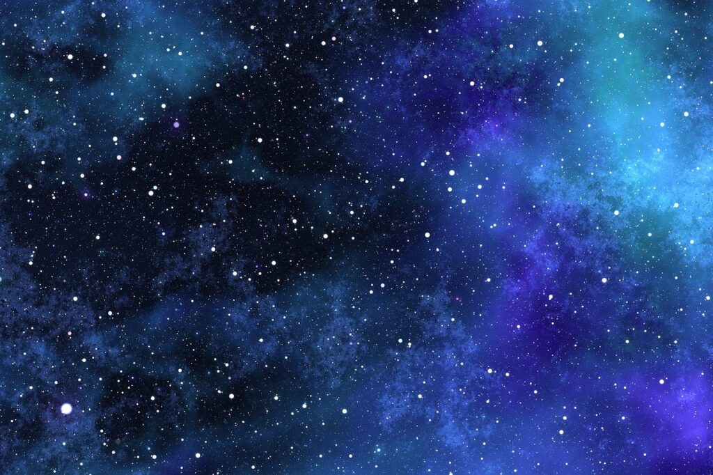 A starry night sky with a cosmic blend of blue and purple nebulae.