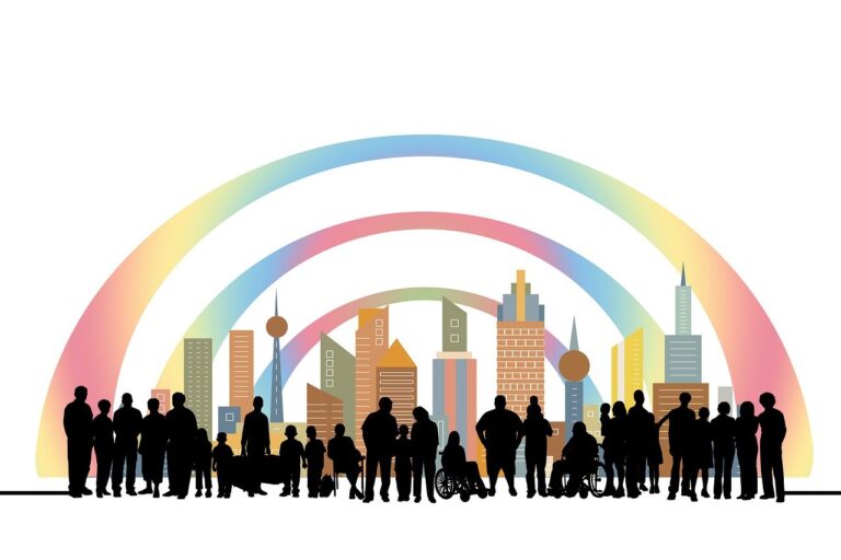 Silhouettes of diverse people in front of a colorful cityscape with rainbow arcs overhead.