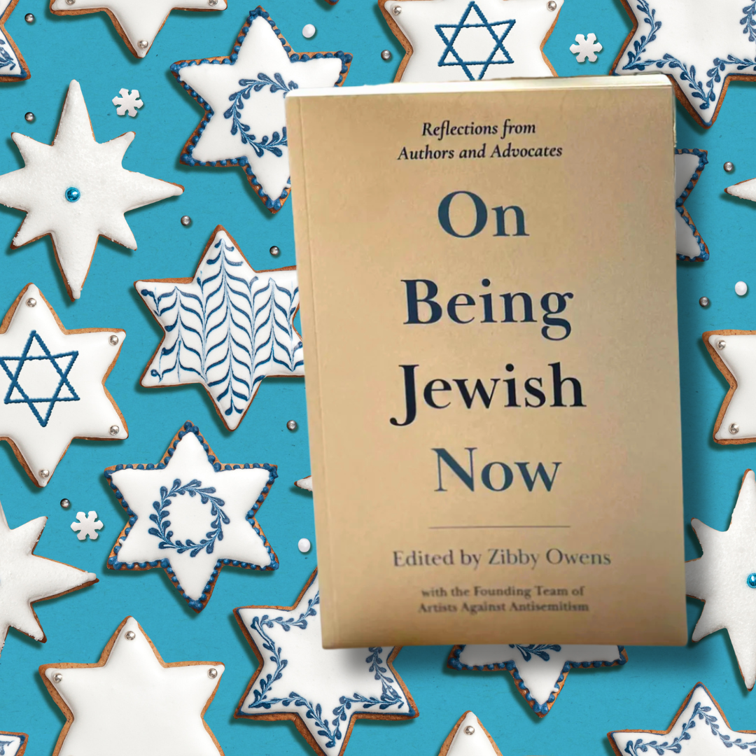 Book On Being Jewish Now on a blue background with white star-shaped cookies decorated in blue.