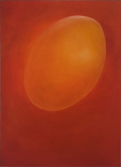 An orange oval shape against a red background, creating a soft, glowing effect.