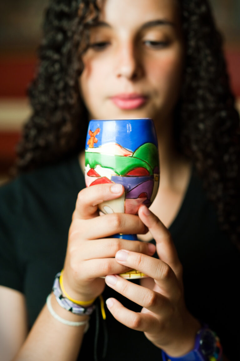 adult holding kiddush cup 19