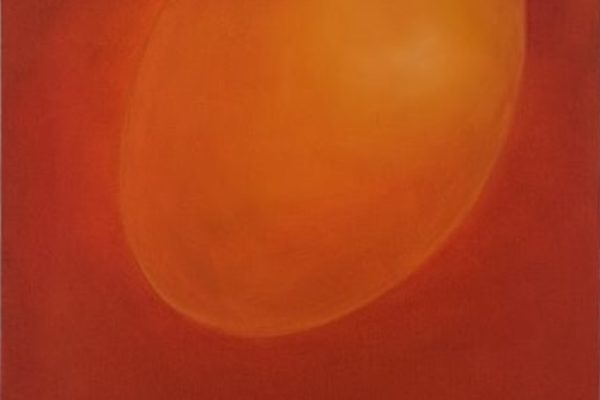 An orange oval shape against a red background, creating a soft, glowing effect.