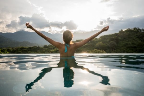 a person with outstretched arms in the water