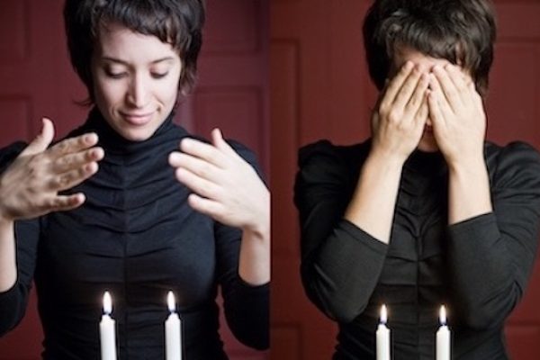 split screen of two photos, one of light-skinned woman with short brown hair, hands open over lit shabbat candles, second image same woman has her hands over her face blessing the shabbat candles