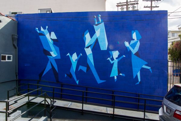 a blue mural of people dancing with Torah scrolls