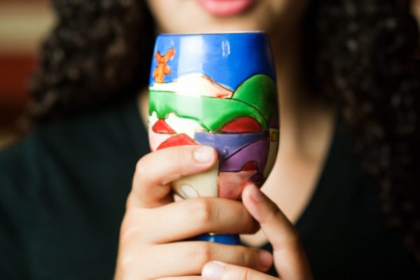 adult holding kiddush cup 19