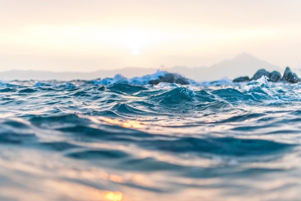 close up of ocean water with sunlight on the surface