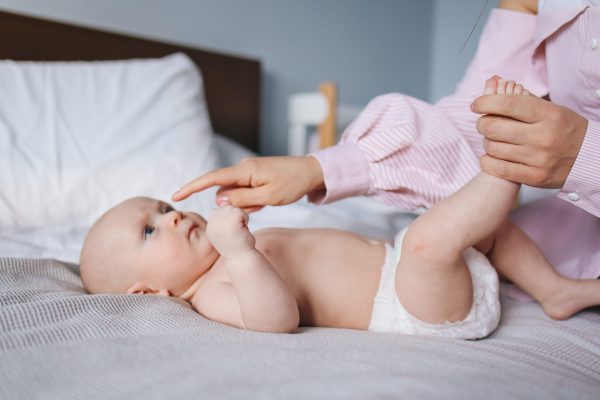 baby being tapped on nose