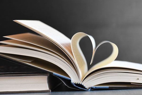 a heart shape created from pages of an open book