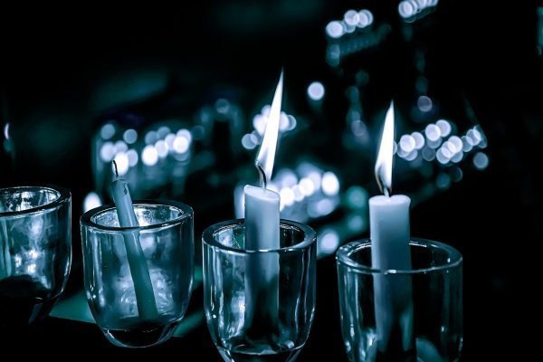 candles set in glass votives