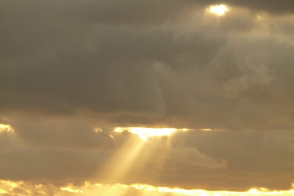 sun streaming through clouds