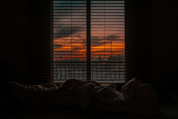 dark bedroom with dawn through window