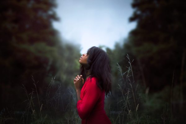 a woman looks up to the sky