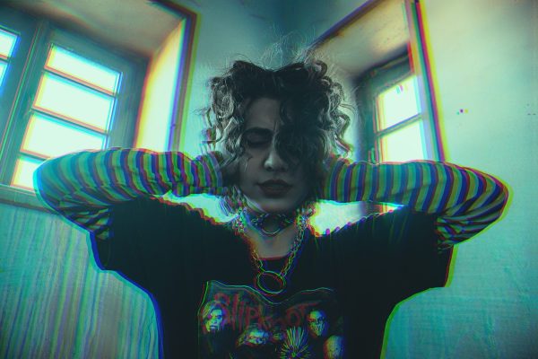 a person holds their hands to their ears in distress