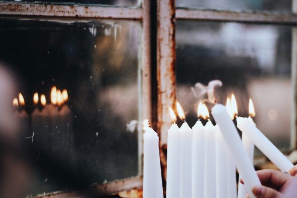 lighting hanukkah candles