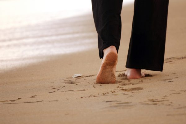 a person walking on a beach