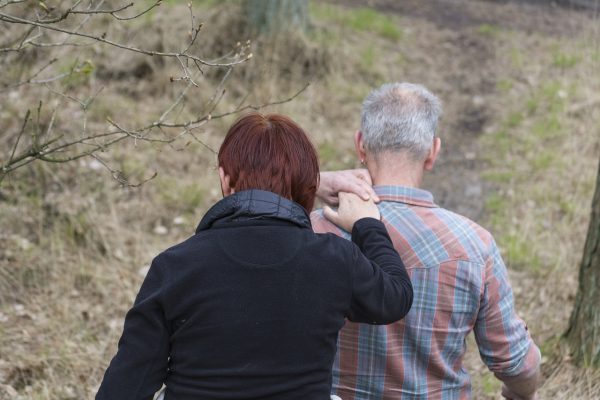 one person leading another