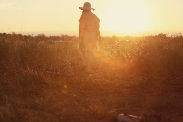 a person walks in a field of light