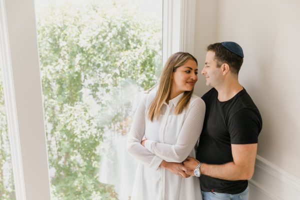 man and woman looking loving