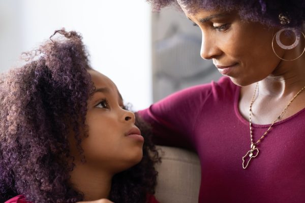mother looking into childs eyes