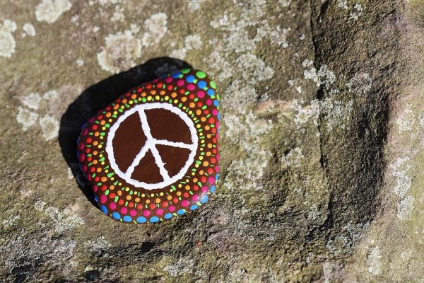 a peace sign painted on a stone